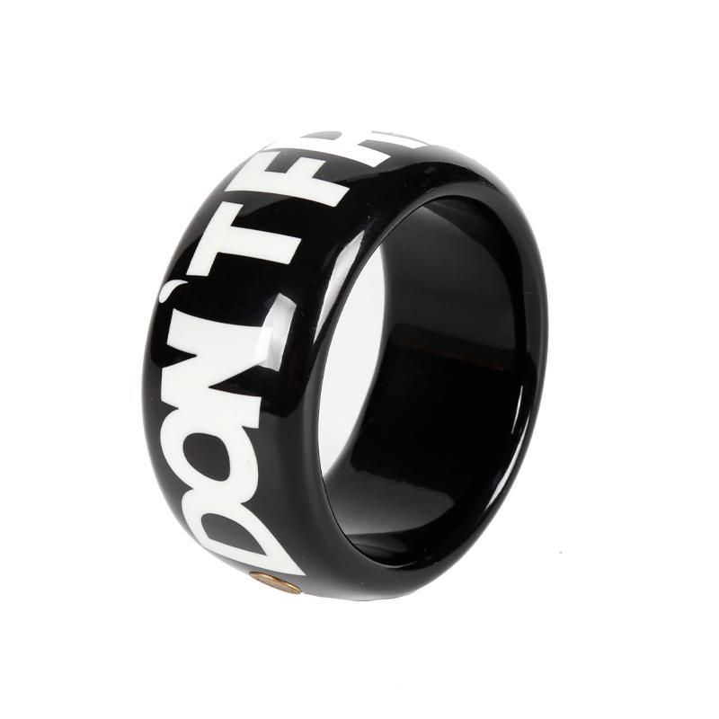 Fashion Bracelet with White Letters on Black Background